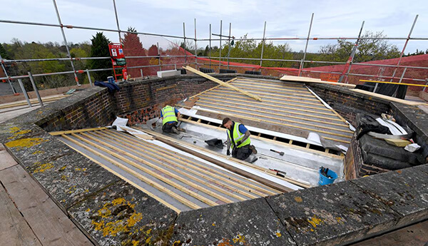Historic Roof Restoration Underway at School Towers